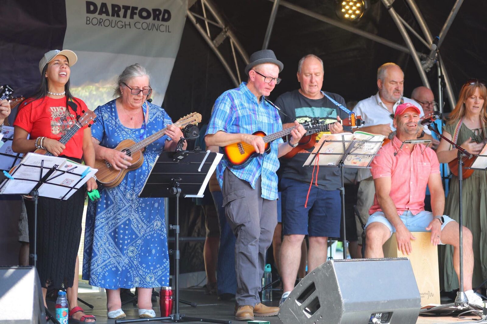 Community ukulele musicians performing together on the main stage at Dartford's Big Day Out
